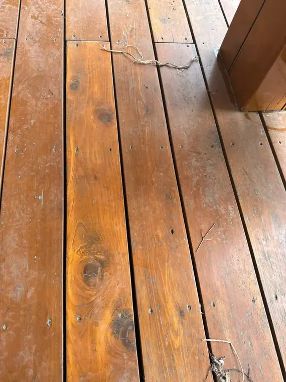 Weathered inner-city Calgary deck before refinishing by Dynamic Painting