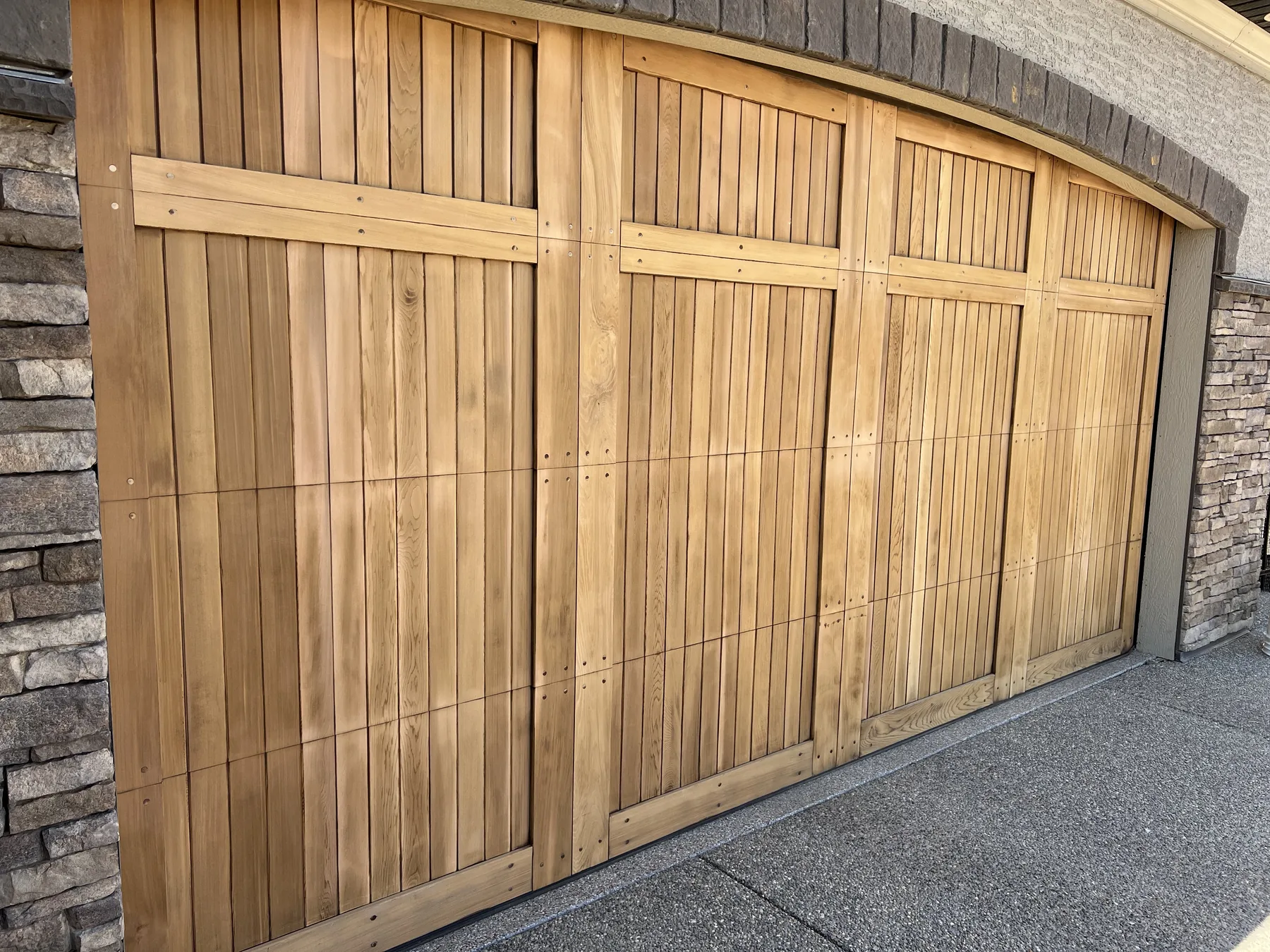 Cedar garage door after sanding and preparation before final refinishing by Dynamic Painting