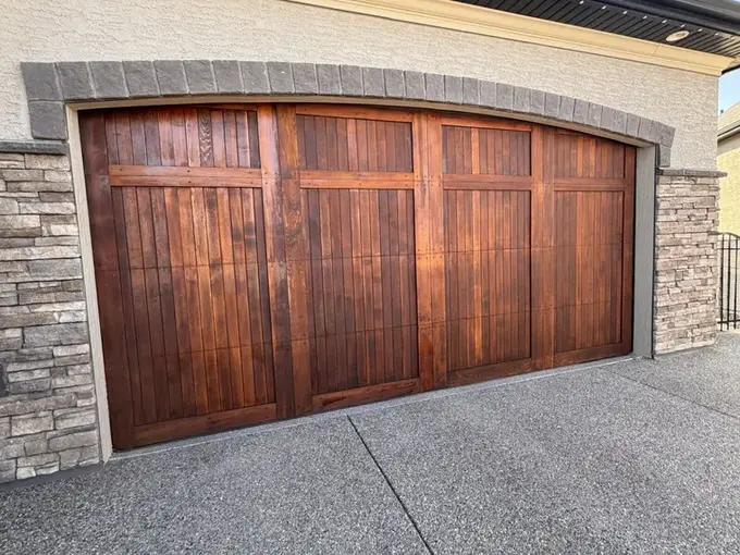 Finished wood garage door in Cranston after refinishing