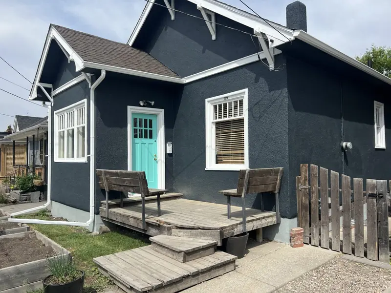 Charcoal stucco house after painting